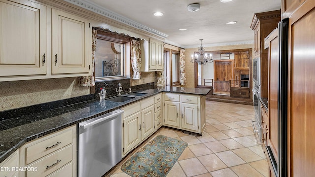 212 Douglas Ave, Sweetwater, TN 37874 - kitchen featuring stainless steel dishwasher, cream cabinets, fridge, and an inviting chandelier
