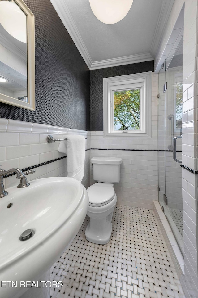 212 Douglas Ave, Sweetwater, TN 37874 - full bathroom featuring a sink, tile walls, crown molding, a shower stall, and wainscoting
