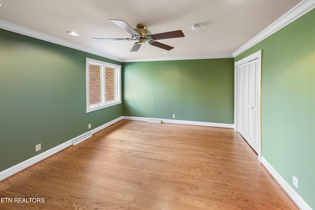 212 Douglas Ave, Sweetwater, TN 37874 - spare room with light wood-style flooring, a ceiling fan, ornamental molding, visible vents, and baseboards