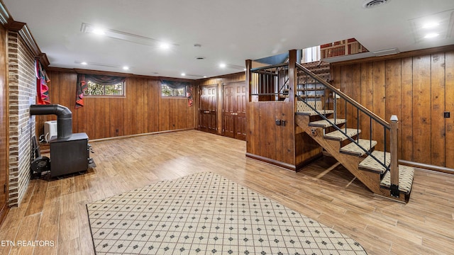 212 Douglas Ave, Sweetwater, TN 37874 - interior space with wood finished floors, a wood stove, wooden walls, and stairs