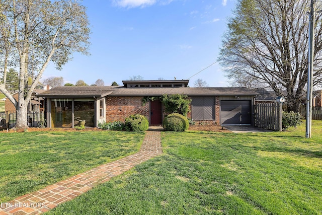 212 Douglas Ave, Sweetwater, TN 37874 - mid-century home with a garage, fence, and a front lawn