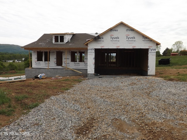 138 Nevils St, Harrogate, TN 37752 - unfinished property featuring gravel driveway, a porch, and a shingled roof