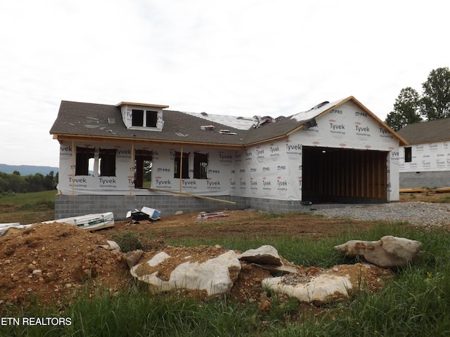 138 Nevils St, Harrogate, TN 37752 - property under construction featuring a garage, a porch, and gravel driveway