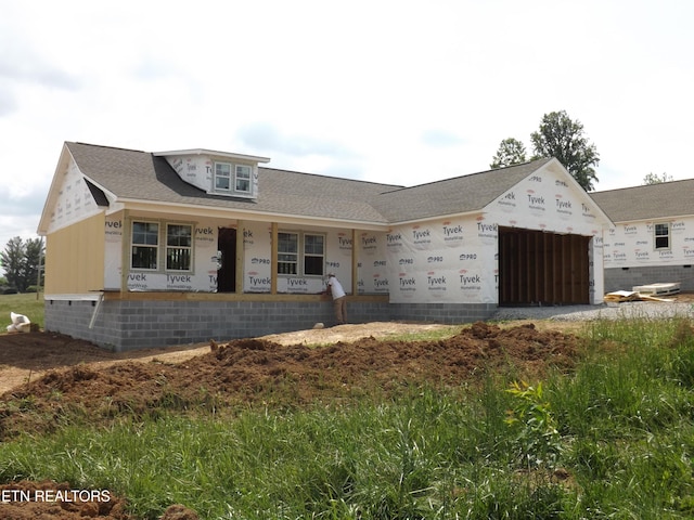 138 Nevils St, Harrogate, TN 37752 - property under construction featuring a garage, covered porch, and a shingled roof