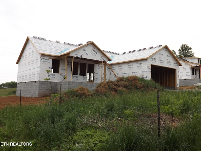152 Nevils St, Harrogate, TN 37752 - unfinished property featuring an attached garage and covered porch