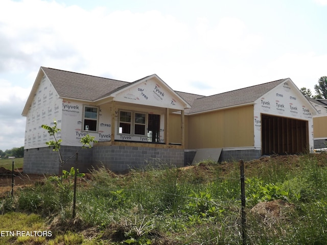 152 Nevils St, Harrogate, TN 37752 - unfinished property with an attached garage and a shingled roof