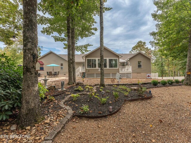 533 T Rd, Monterey, TN 38574 - back of property featuring roof with shingles and a deck