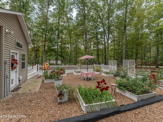 533 T Rd, Monterey, TN 38574 - view of yard featuring fence and a vegetable garden