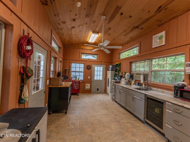 533 T Rd, Monterey, TN 38574 - kitchen with vaulted ceiling, gray cabinets, wooden ceiling, a sink, and wine cooler