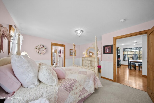 533 T Rd, Monterey, TN 38574 - carpeted bedroom featuring wood finished floors and a wainscoted wall