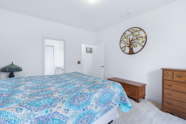 bedroom featuring light wood-type flooring