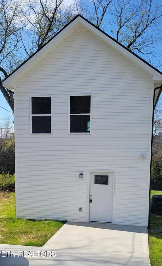 view of side of home with cooling unit