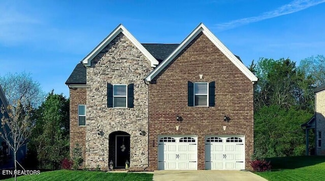 12751 Baltica Ln, Farragut, TN 37934 - view of front of house with driveway, stone siding, an attached garage, a front lawn, and brick siding