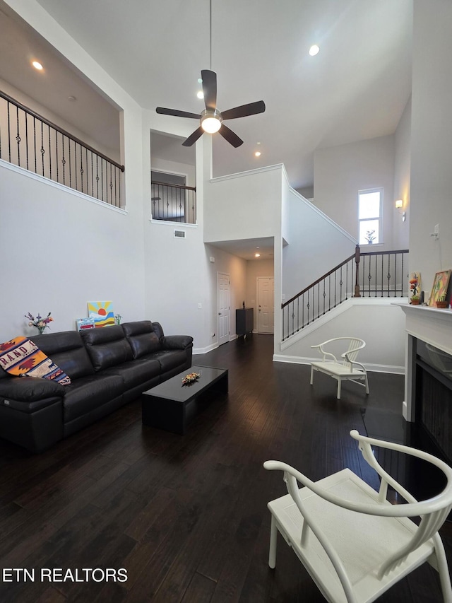12751 Baltica Ln, Farragut, TN 37934 - living area with wood finished floors, ceiling fan, recessed lighting, stairs, and a towering ceiling