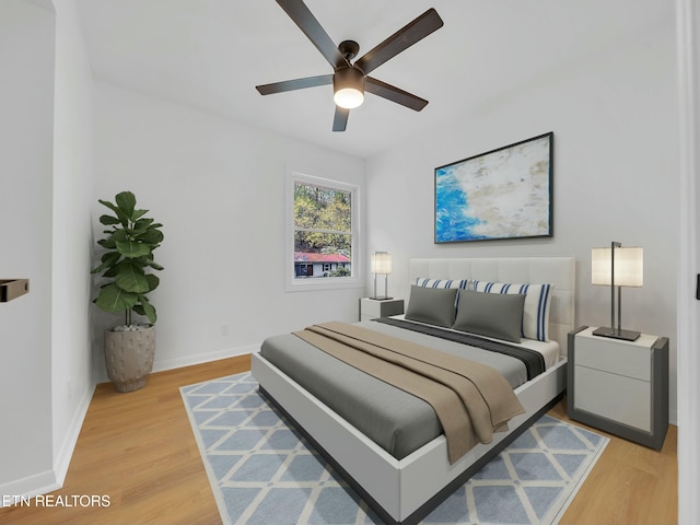 2249 Knollcrest Ln, Knoxville, TN 37920 - bedroom featuring baseboards, ceiling fan, and light wood-style floors