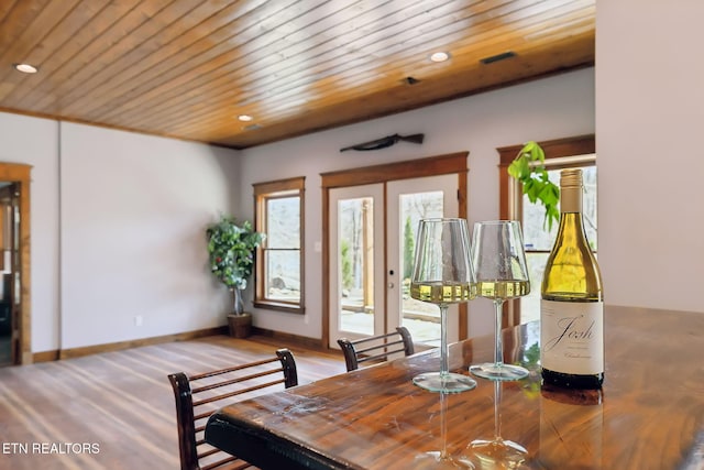 dining space featuring wood ceiling, a healthy amount of sunlight, and recessed lighting