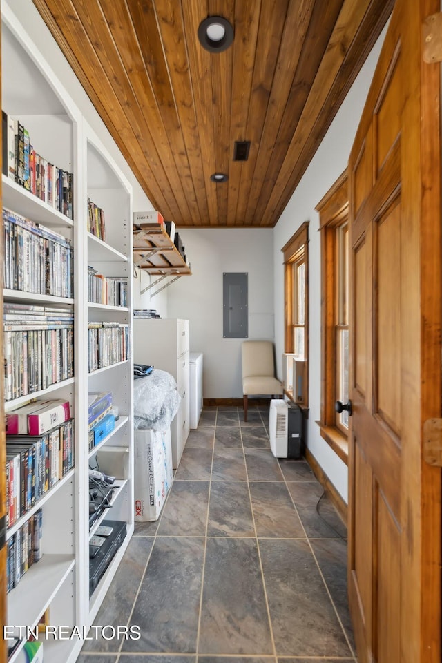 washroom with electric panel, baseboards, visible vents, and wood ceiling