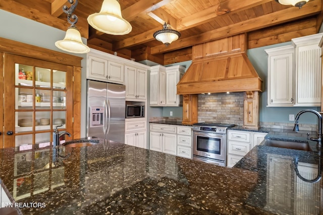 kitchen with wood ceiling, a sink, premium range hood, and appliances with stainless steel finishes