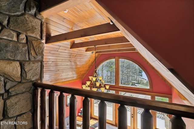 staircase featuring vaulted ceiling with beams, a notable chandelier, and wooden ceiling