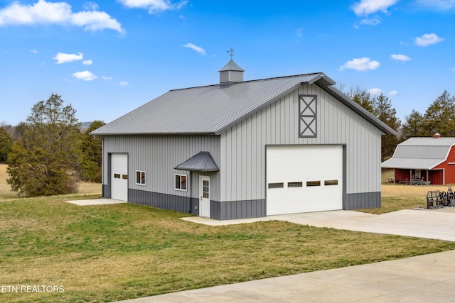 8207 Washington Pike, Corryton, TN 37721 - view of front of property with a detached garage, an outbuilding, metal roof, and a front yard