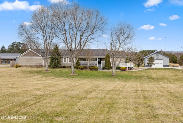 8207 Washington Pike, Corryton, TN 37721 - ranch-style home featuring an outbuilding, a porch, a garage, and a front lawn