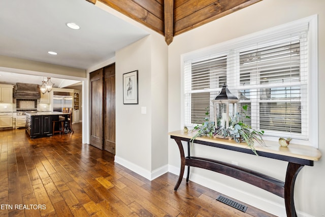8207 Washington Pike, Corryton, TN 37721 - hallway with a wealth of natural light, dark wood-style floors, baseboards, and visible vents