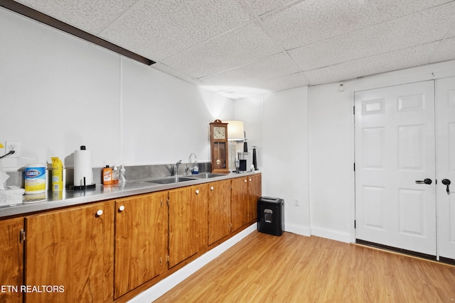 8207 Washington Pike, Corryton, TN 37721 - bar with baseboards, a sink, a drop ceiling, and light wood finished floors