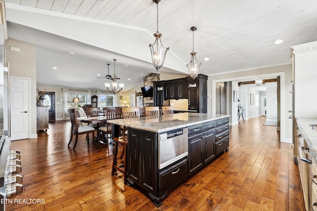8207 Washington Pike, Corryton, TN 37721 - kitchen with vaulted ceiling, a chandelier, a breakfast bar area, a warming drawer, and dark wood-style flooring