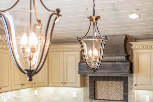 8207 Washington Pike, Corryton, TN 37721 - details featuring an inviting chandelier, cream cabinetry, and tasteful backsplash