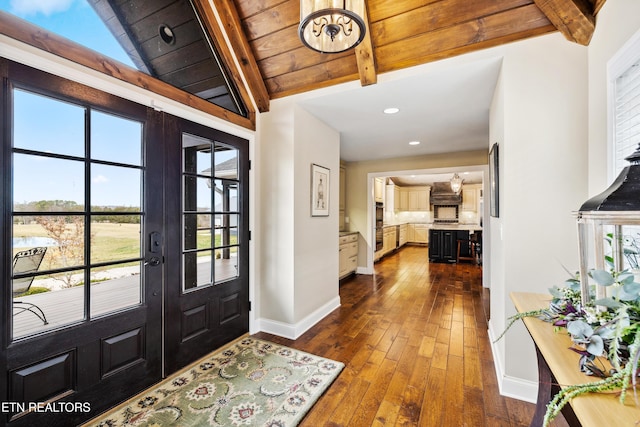 8207 Washington Pike, Corryton, TN 37721 - foyer entrance with baseboards, dark wood-style flooring, french doors, and lofted ceiling with beams