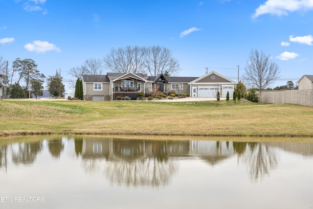 8207 Washington Pike, Corryton, TN 37721 - exterior space with a front lawn, fence, a water view, and a garage