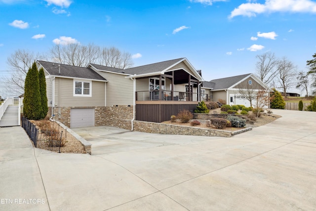 8207 Washington Pike, Corryton, TN 37721 - ranch-style home featuring fence, a garage, stairway, driveway, and covered porch