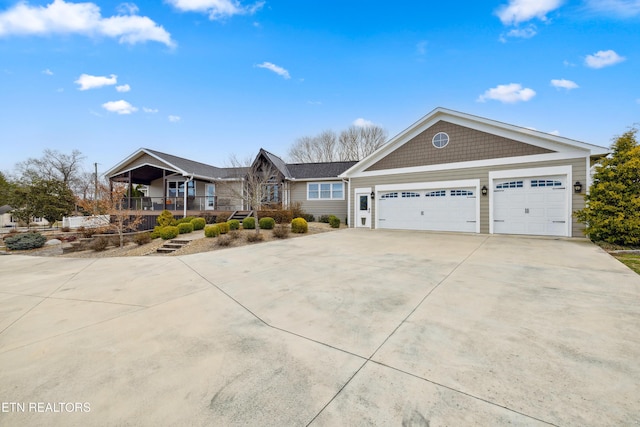 8207 Washington Pike, Corryton, TN 37721 - view of front facade with driveway, stairs, and an attached garage