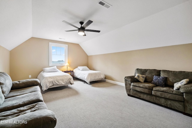 carpeted bedroom featuring baseboards, lofted ceiling, and ceiling fan