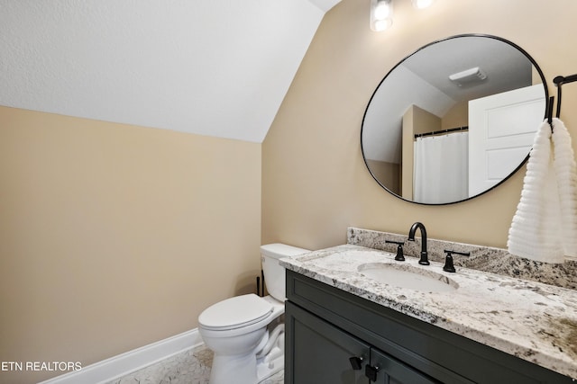 full bath with vanity, toilet, baseboards, marble finish flooring, and vaulted ceiling