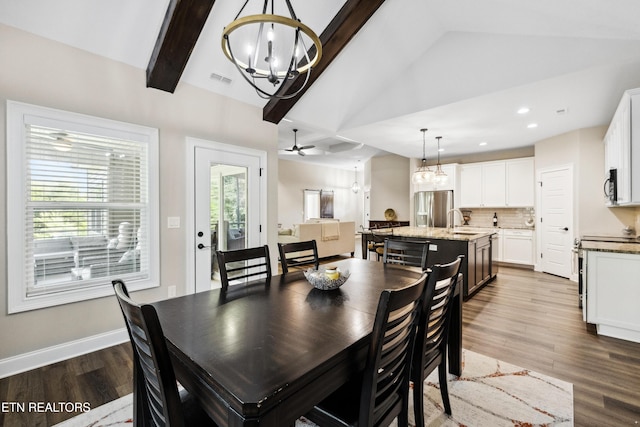 dining space featuring a chandelier, dark wood-type flooring, recessed lighting, and baseboards