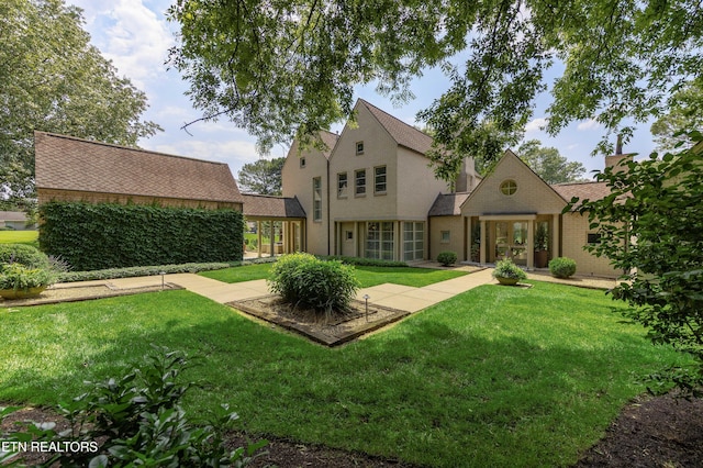11901 S Fox Den Dr, Knoxville, TN 37934 - rear view of house featuring a lawn
