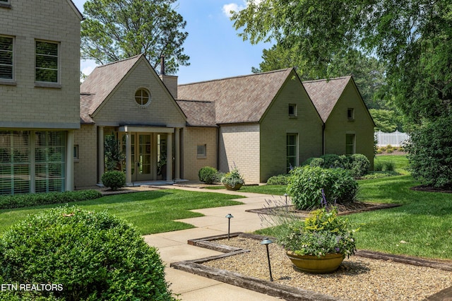 11901 S Fox Den Dr, Knoxville, TN 37934 - view of front of house with a front yard, brick siding, and roof with shingles