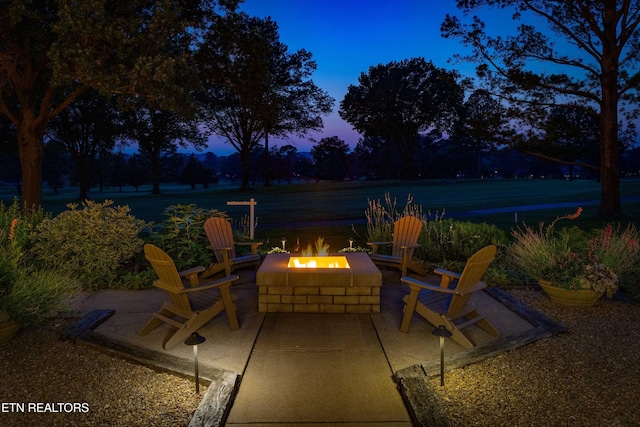 11901 S Fox Den Dr, Knoxville, TN 37934 - patio terrace at dusk featuring a fire pit and a patio area