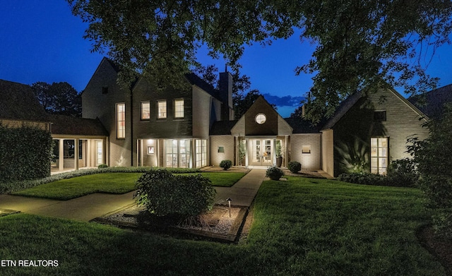 11901 S Fox Den Dr, Knoxville, TN 37934 - back of property featuring french doors, a yard, and a chimney