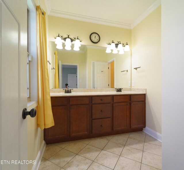 full bathroom with tile patterned floors, crown molding, double vanity, and a sink