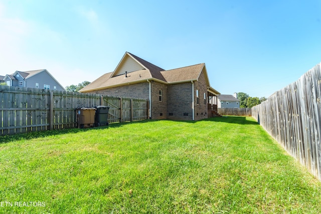 view of yard with a fenced backyard