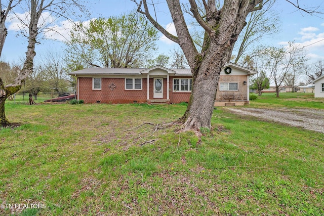 107 Ford St, Byrdstown, TN 38549 - ranch-style house featuring brick siding, a front yard, and crawl space