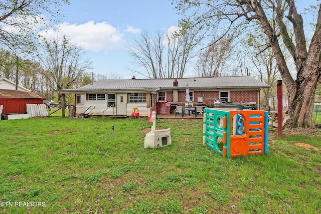 107 Ford St, Byrdstown, TN 38549 - rear view of property with metal roof, fence, a chimney, and a yard