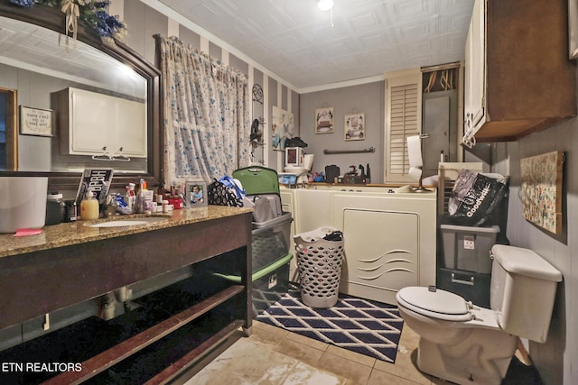 107 Ford St, Byrdstown, TN 38549 - bathroom featuring crown molding, toilet, an ornate ceiling, a sink, and washer and dryer