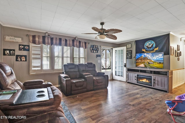107 Ford St, Byrdstown, TN 38549 - living area with a ceiling fan, wood finished floors, a glass covered fireplace, and crown molding