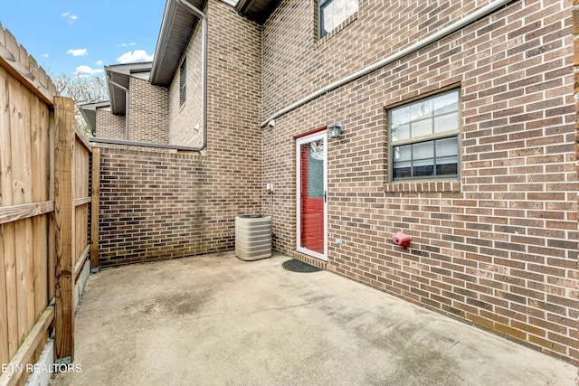 view of patio / terrace with fence and central AC unit