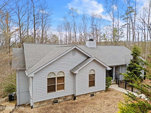 12 Wessex Ct, Crossville, TN 38558 - exterior space with a chimney, central air condition unit, and roof with shingles