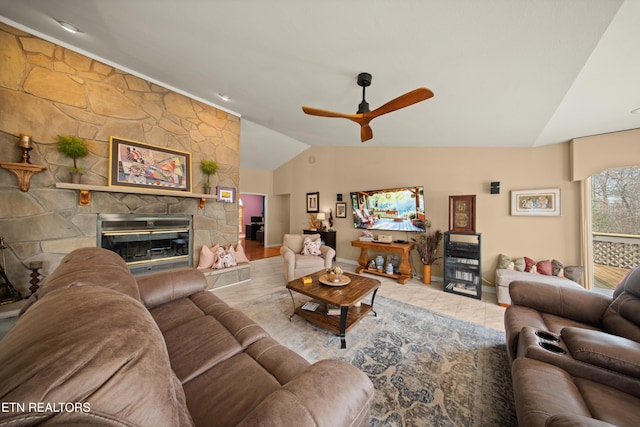 12 Wessex Ct, Crossville, TN 38558 - living area with tile patterned floors, a stone fireplace, lofted ceiling, and ceiling fan