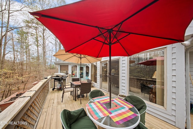 12 Wessex Ct, Crossville, TN 38558 - wooden deck featuring outdoor dining space and area for grilling